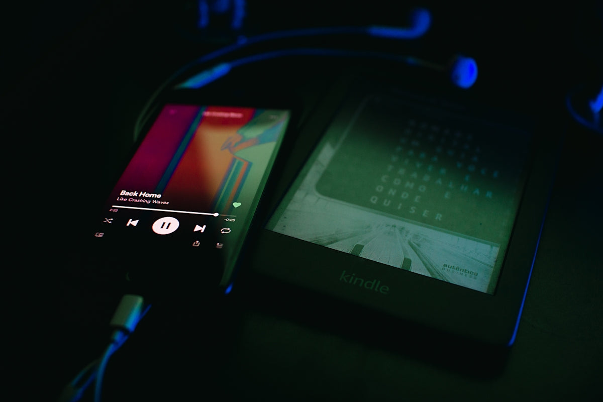 a cell phone sitting on top of a table next to a charger