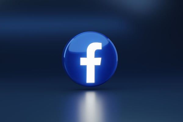 a blue logo with a white cross