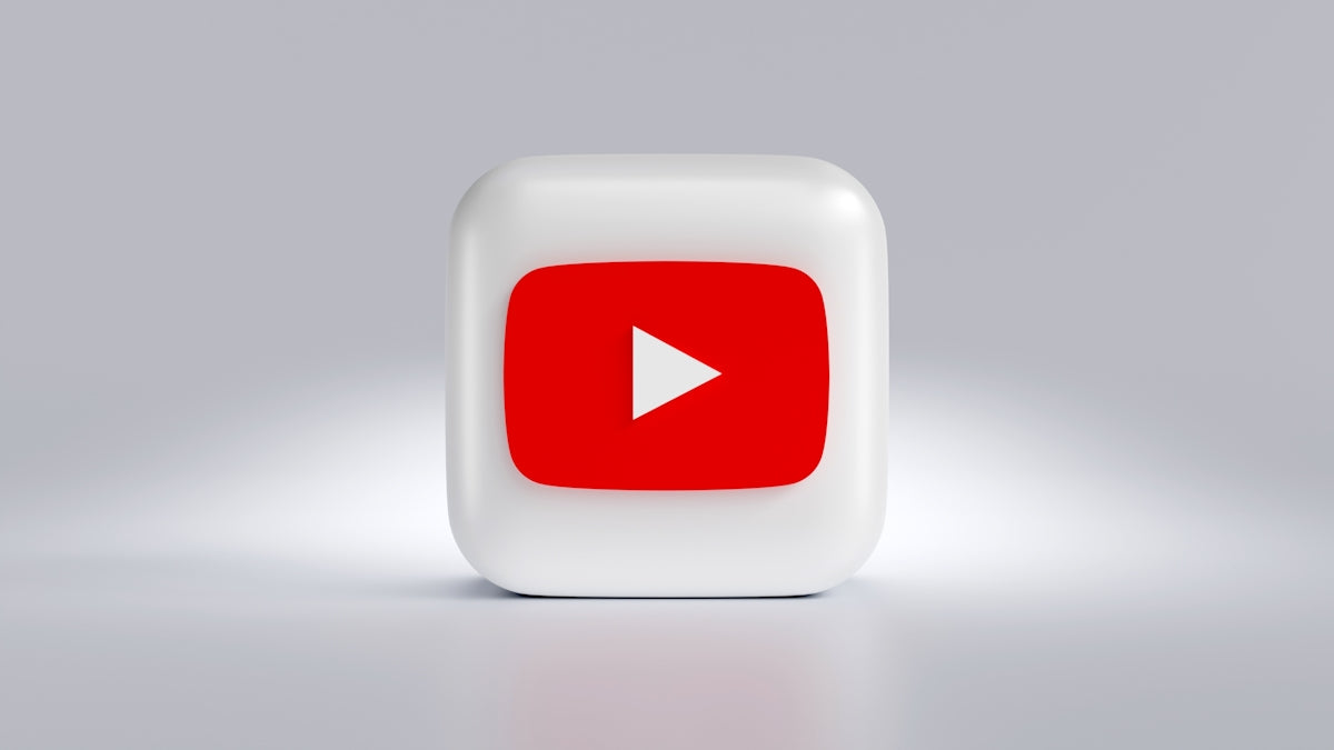 a white square button with a red arrow on it