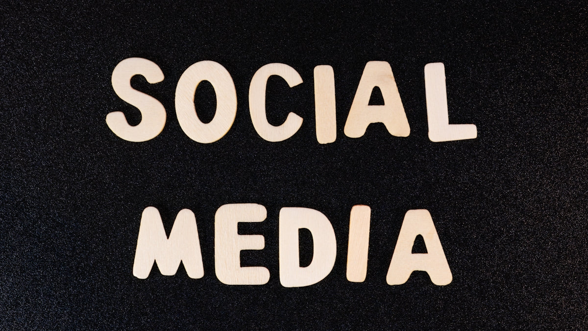 the word social media written in white type on a black background