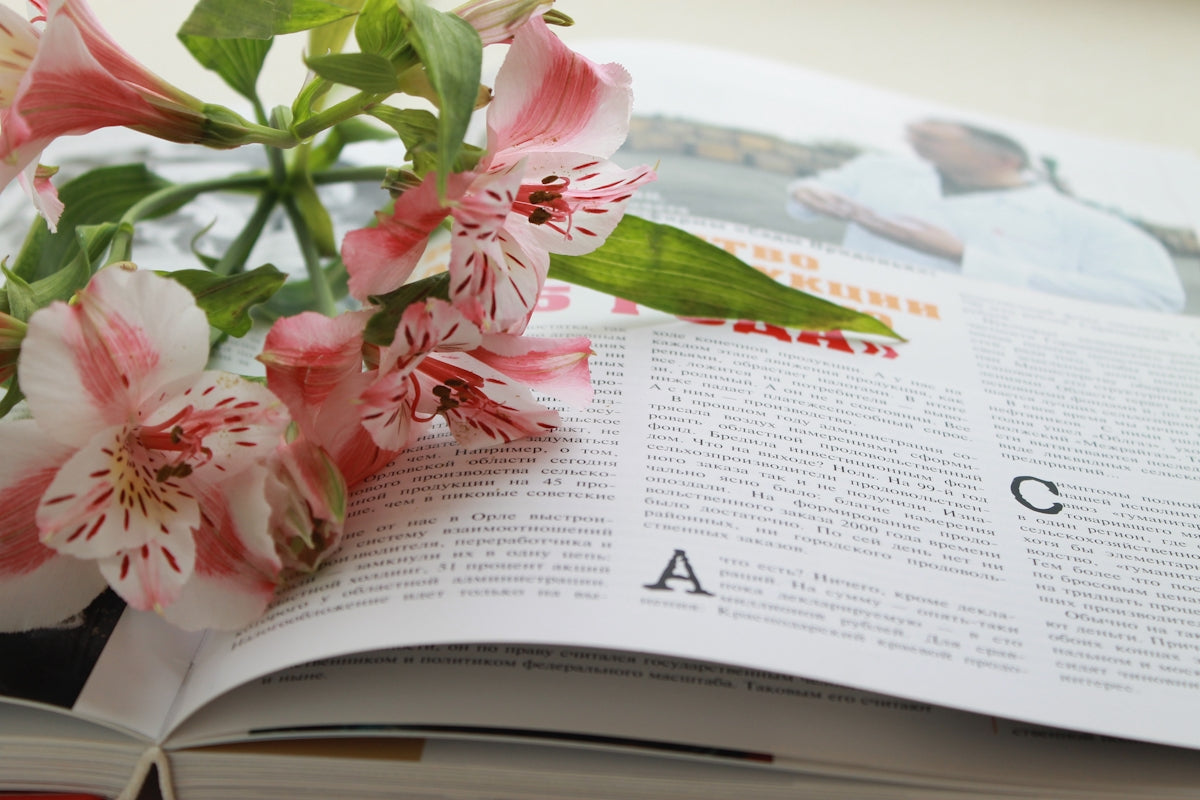 a close up of a book with flowers on it