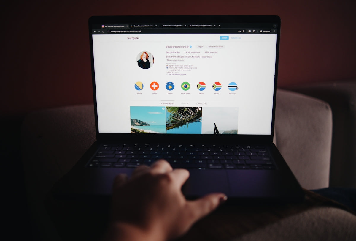 A person sitting on a couch using a laptop