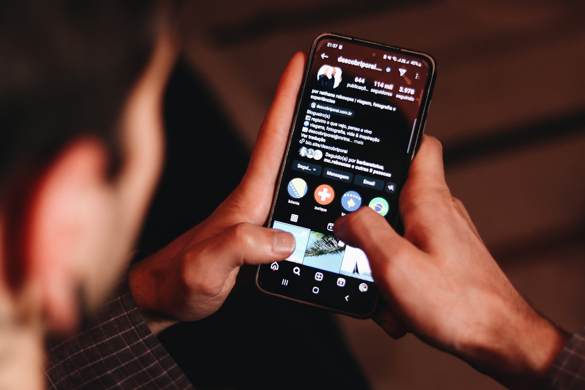 A man holding a cell phone up to his face
