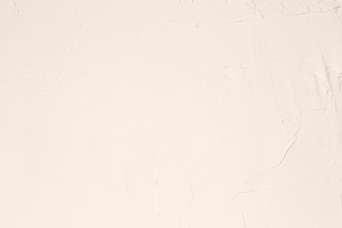 A white sheet with a black cat sitting on top of it