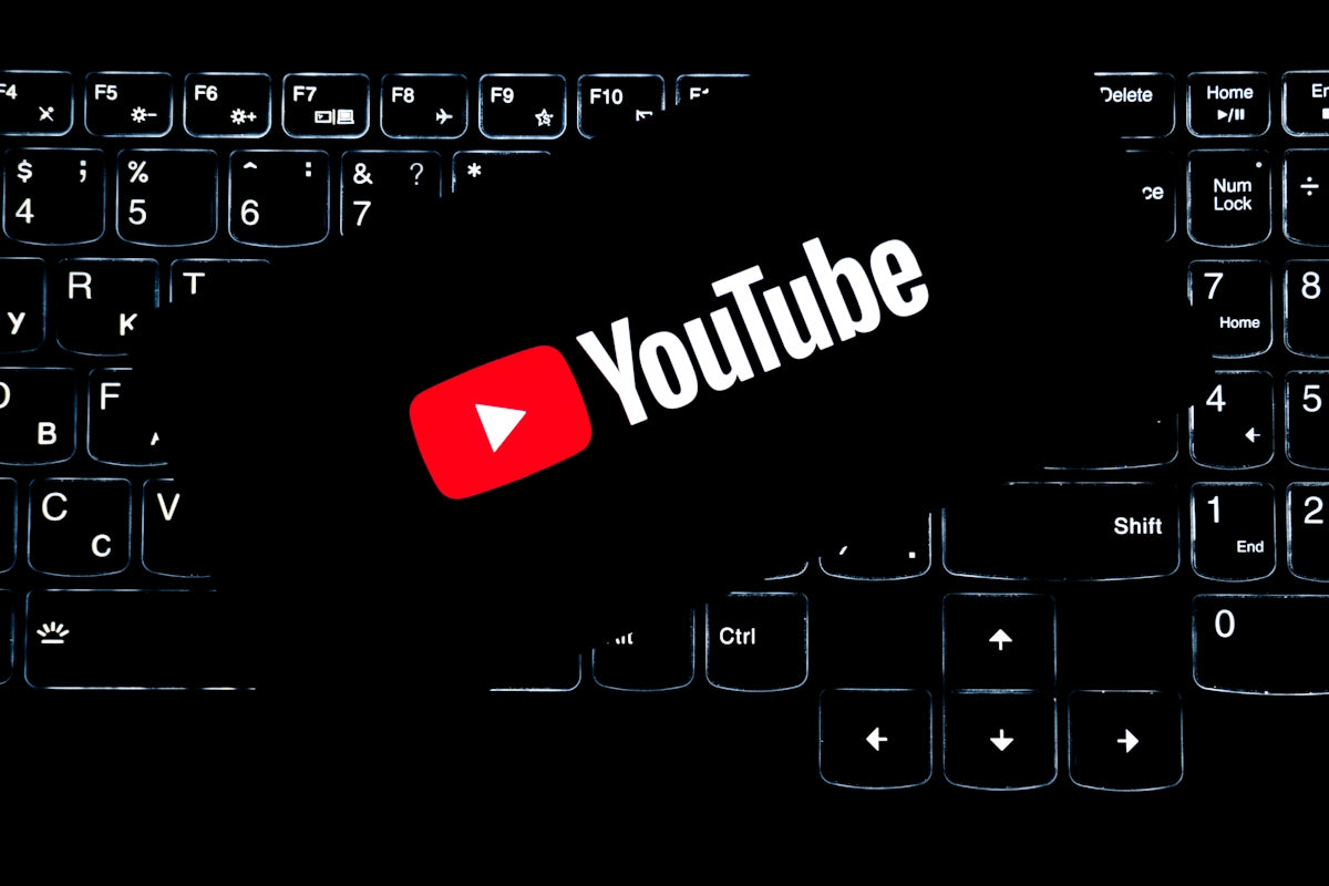 Youtube logo on a backlit keyboard.