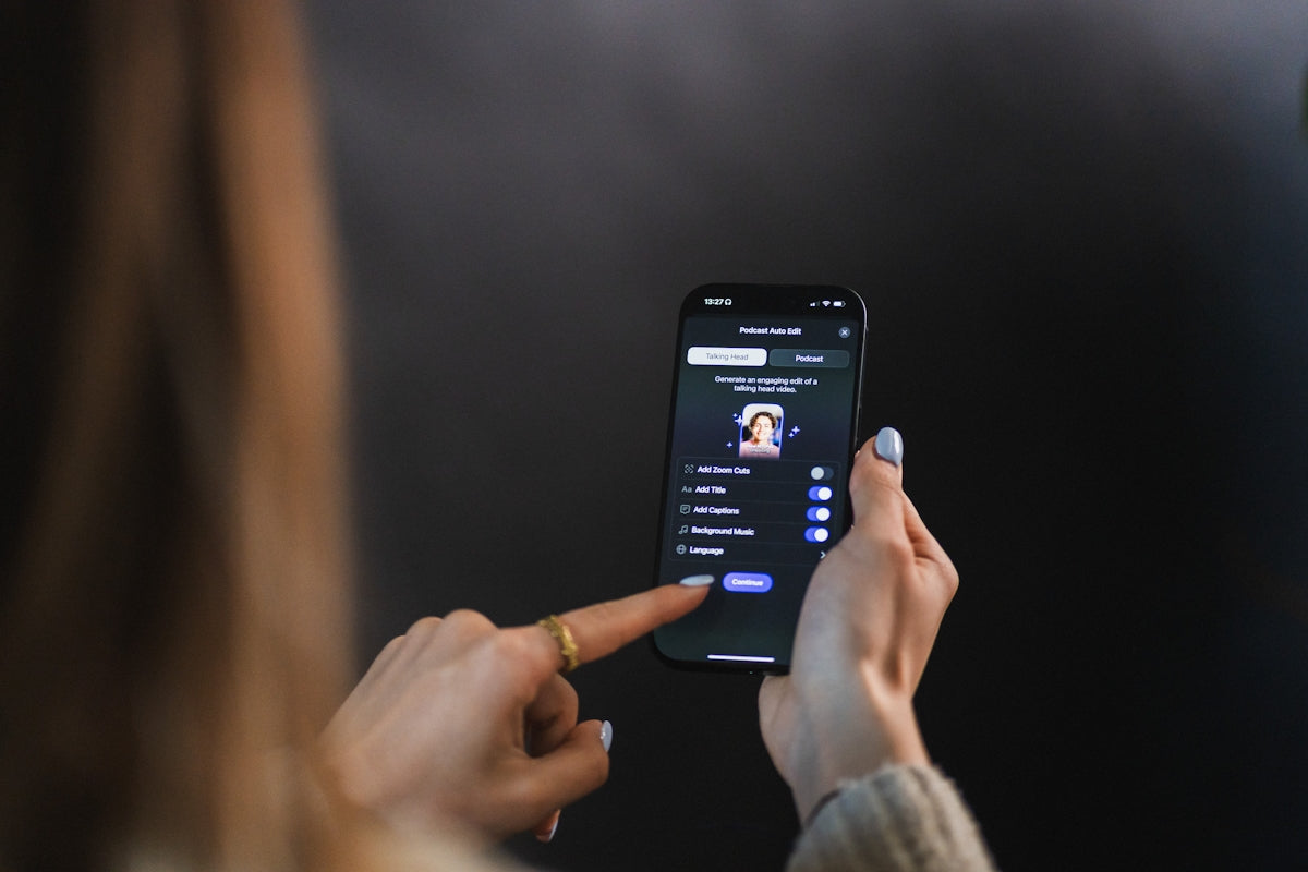 Woman's hand holding and touching smartphone screen of a smartphone