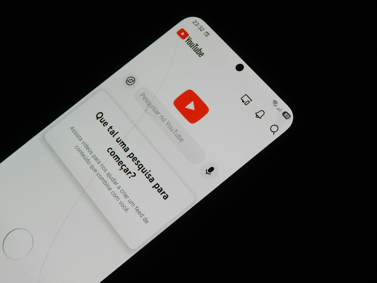 A smartphone screen displaying the YouTube app interface on a black background